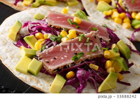 Fish tacos with tuna, red cabbage, corn, avocado 33688242