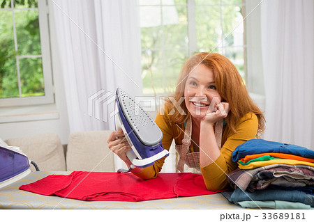Close up portrait of housewife with steaming iron. Close up portrait of housewife with steaming iron. 33689181