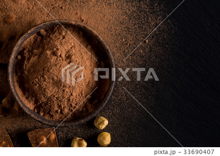 Сocoa powder  chocolate nuts pieces 33690407