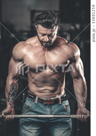 Handsome athletic man on diet training muscles Handsome athletic man on diet training muscles 33691259