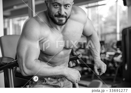 Handsome athletic man on diet training muscles Handsome athletic man on diet training muscles 33691277