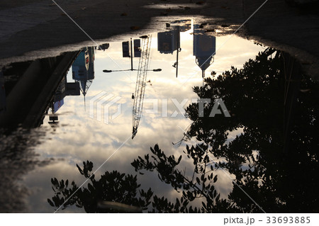 Reflection street in a puddle on the city. Reflection street in a puddle on the city. 33693885