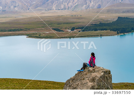 Woman Traveler at Lake Tekapo, New Zealand 33697550