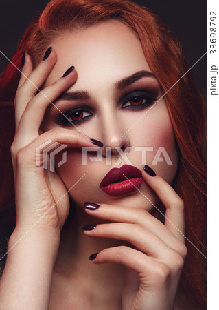 Beautiful vampire young woman Beautiful vampire young woman 33698792