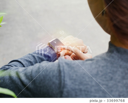 close-up woman using smart watch on hand close-up woman using smart watch on hand 33699768