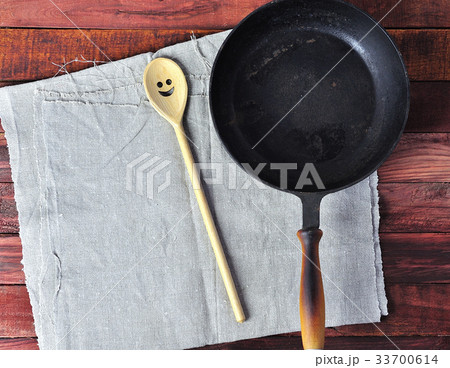 Empty black cast-iron frying pan Empty black cast-iron frying pan 33700614