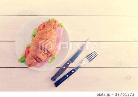 croissant stuffed with ham and herbs on white croissant stuffed with ham and herbs on white 33701572