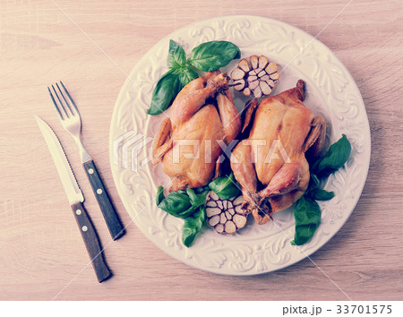 whole roasted chicken with bound with twine 33701575