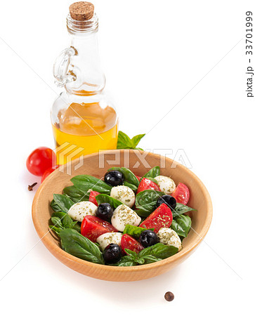 caprese salad in plate on white background caprese salad in plate on white background 33701999