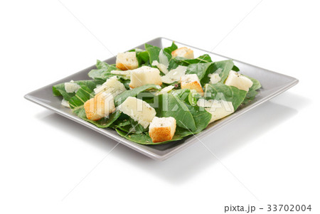 caesar salad in plate on white background 33702004