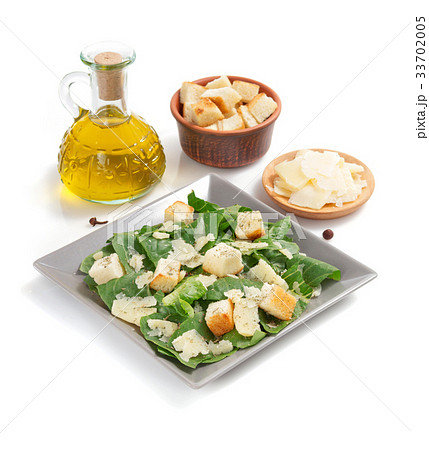 caesar salad in plate on white background 33702005