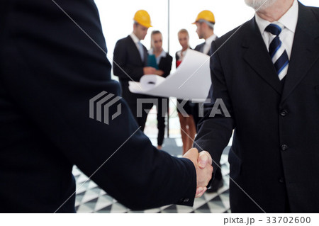 Business meeting of architects and investors Business meeting of architects and investors 33702600