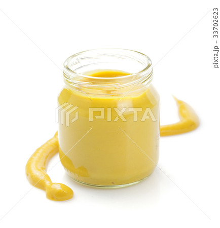 mustard sauce in jar on white 33702623