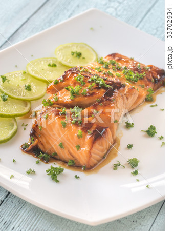 Honey lime salmon on the plate 33702934