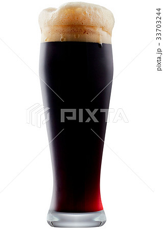 Mug of frosty dark beer with foam 33703244