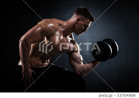 Athletic male with dumbbells 33704906