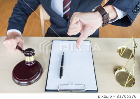 Law court or justice concept. Portrait lawyer making thumb down 33705576