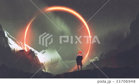 man standing in front of red light circle 33706948