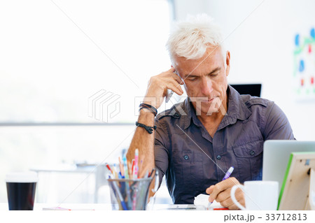 Handsome businessman in office Handsome businessman in office 33712813