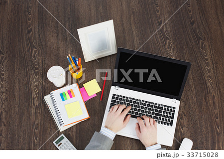 Office workplace with office supplies and laptop 33715028