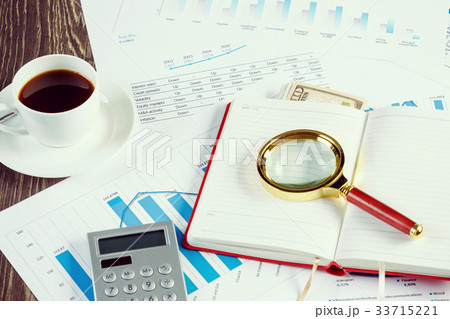 Financial charts and graphs on the table Financial charts and graphs on the table 33715221