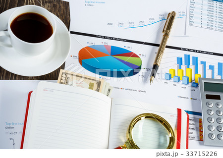 Financial charts and graphs on the table Financial charts and graphs on the table 33715226