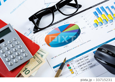 Financial charts and graphs on the table Financial charts and graphs on the table 33715231