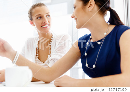 Two female colleagues in office 33717199