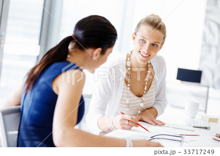 Two female colleagues in office 33717249