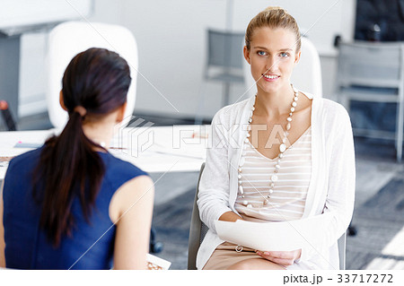 Two female colleagues in office 33717272