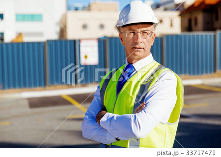 Engineer builder at construction site 33717471