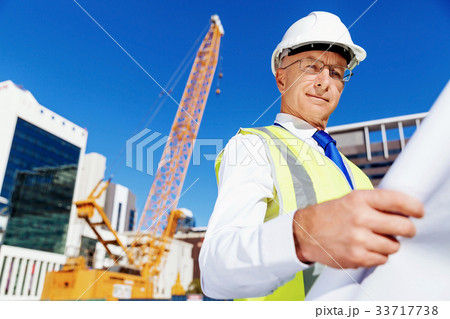 Engineer builder at construction site 33717738