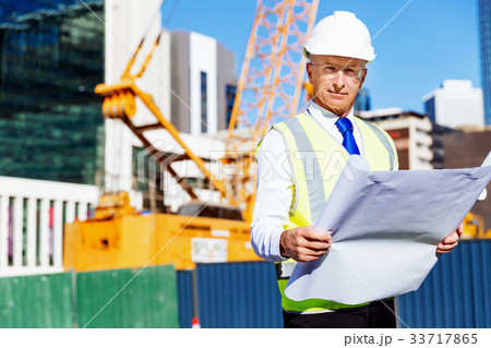 Engineer builder at construction site Engineer builder at construction site 33717865