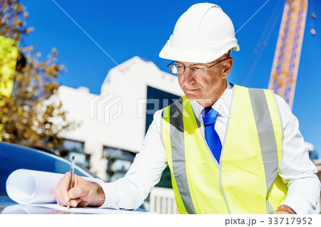 Engineer builder at construction site 33717952