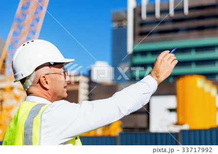 Engineer builder at construction site Engineer builder at construction site 33717992