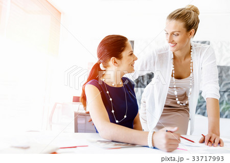 Two female colleagues in office Two female colleagues in office 33717993