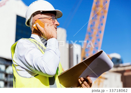 Engineer builder at construction site Engineer builder at construction site 33718062