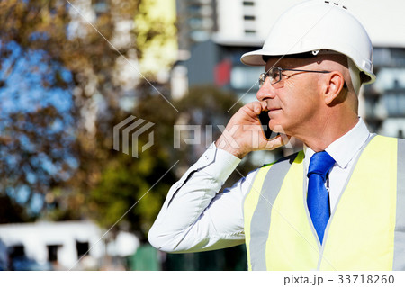 Businessman at construction site 33718260