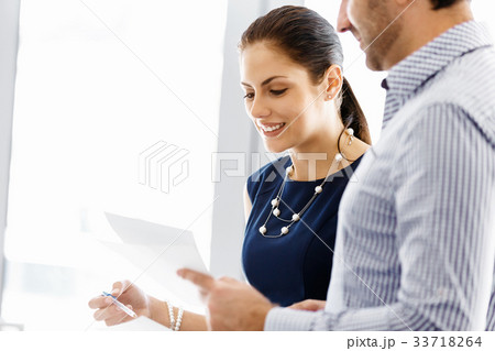 Business people in modern office Business people in modern office 33718264
