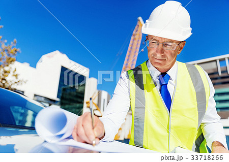 Engineer builder at construction site Engineer builder at construction site 33718266