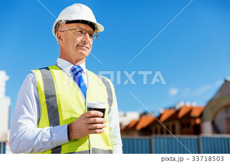 Engineer builder at construction site 33718503