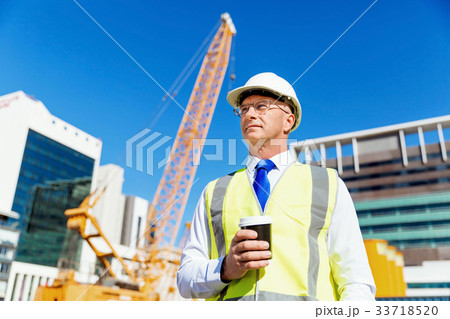 Engineer builder at construction site 33718520