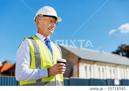Engineer builder at construction site 33718582