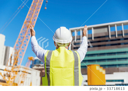 Engineer builder at construction site 33718613