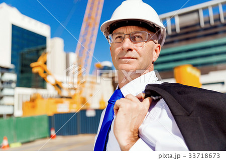 Businessman at construction site Businessman at construction site 33718673