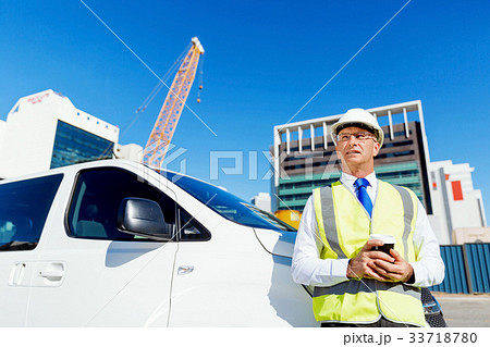 Engineer builder at construction site 33718780