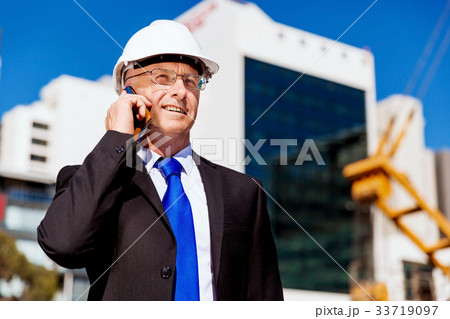 Businessman at construction site Businessman at construction site 33719097