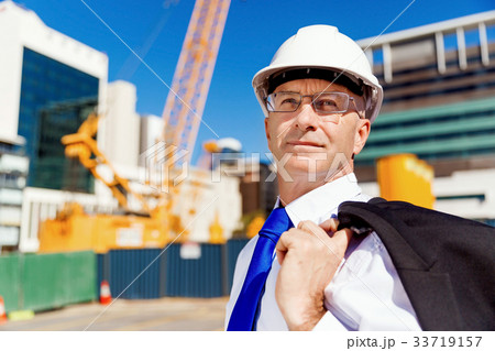 Businessman at construction site 33719157