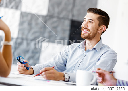 Handsome businessman in office Handsome businessman in office 33719553