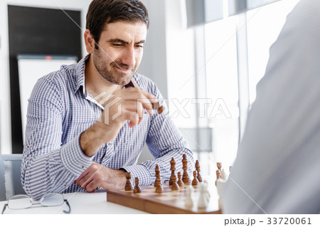 Portrait of two young man playing chess 33720061